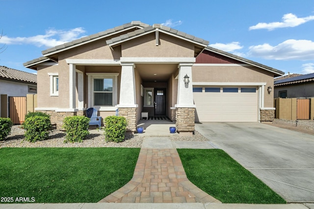 view of front of property featuring a front lawn and a garage