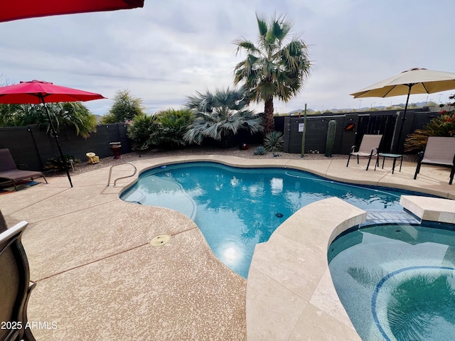 view of swimming pool featuring a patio