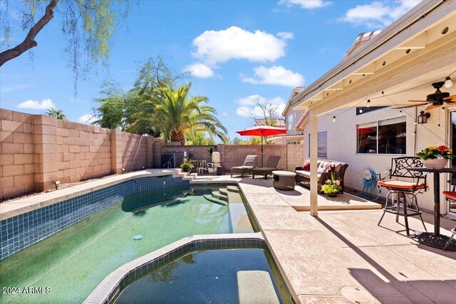 view of swimming pool with a patio area and an outdoor living space