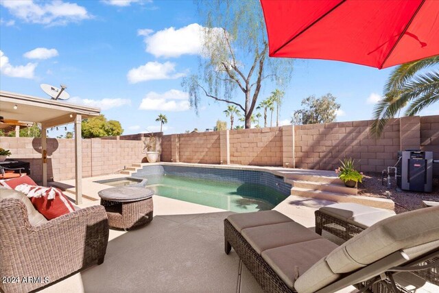 view of swimming pool featuring a patio and an outdoor hangout area