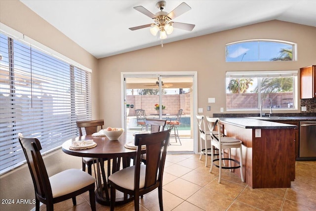 dining room featuring vaulted ceiling, ceiling fan, and light tile patterned floors