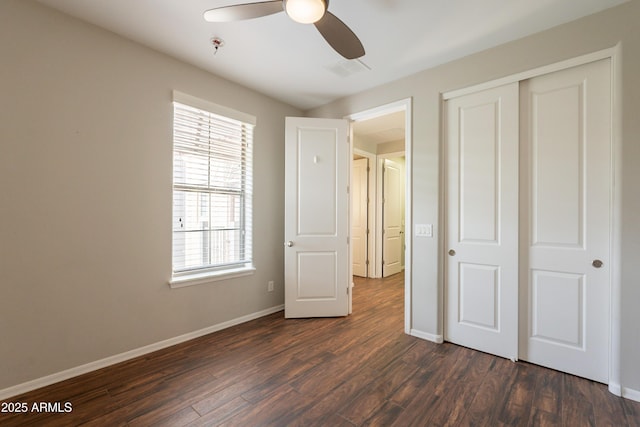 18283 N 93rd St, Scottsdale, AZ 85255 - unfurnished bedroom featuring dark wood-style floors, baseboards, a closet, and ceiling fan