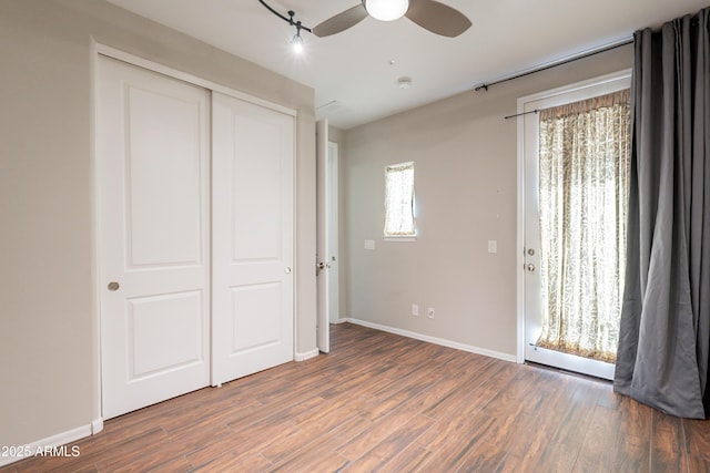 18283 N 93rd St, Scottsdale, AZ 85255 - unfurnished bedroom featuring wood finished floors, baseboards, a closet, and ceiling fan
