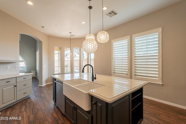 18283 N 93rd St, Scottsdale, AZ 85255 - kitchen with a sink, arched walkways, baseboards, recessed lighting, and dark wood-type flooring