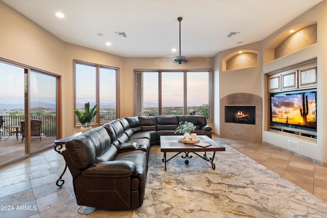 living room featuring a healthy amount of sunlight and a mountain view