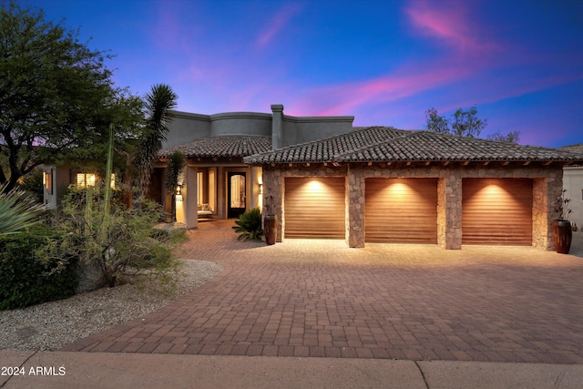 view of front of property with a garage