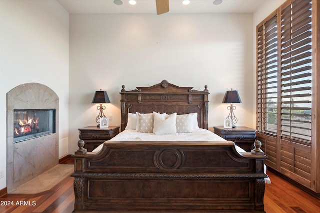 bedroom with hardwood / wood-style floors