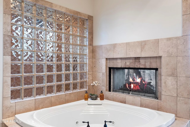 bathroom featuring a relaxing tiled tub