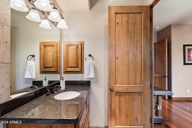 bathroom featuring wood-type flooring and vanity