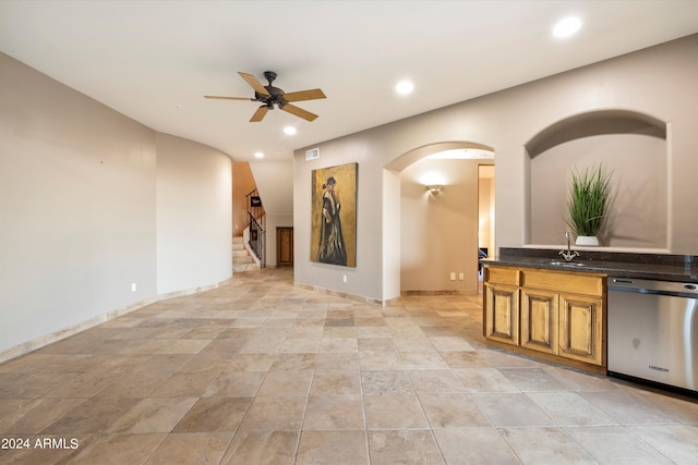 interior space with ceiling fan, dishwasher, and sink