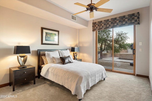 bedroom with access to outside, light colored carpet, and ceiling fan