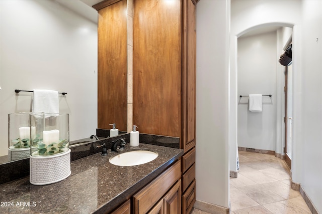 bathroom with tile patterned floors and vanity