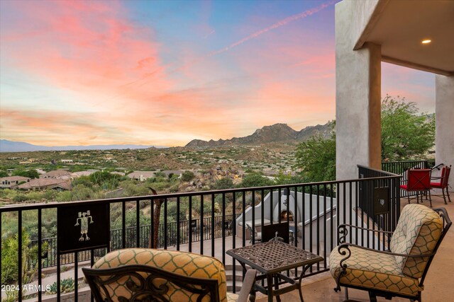 balcony at dusk with a mountain view