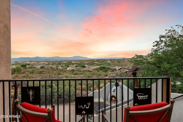 balcony at dusk with a mountain view