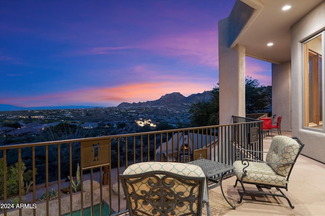 balcony at dusk with a mountain view