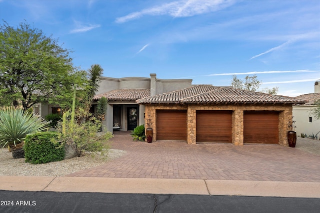 view of front of home with a garage