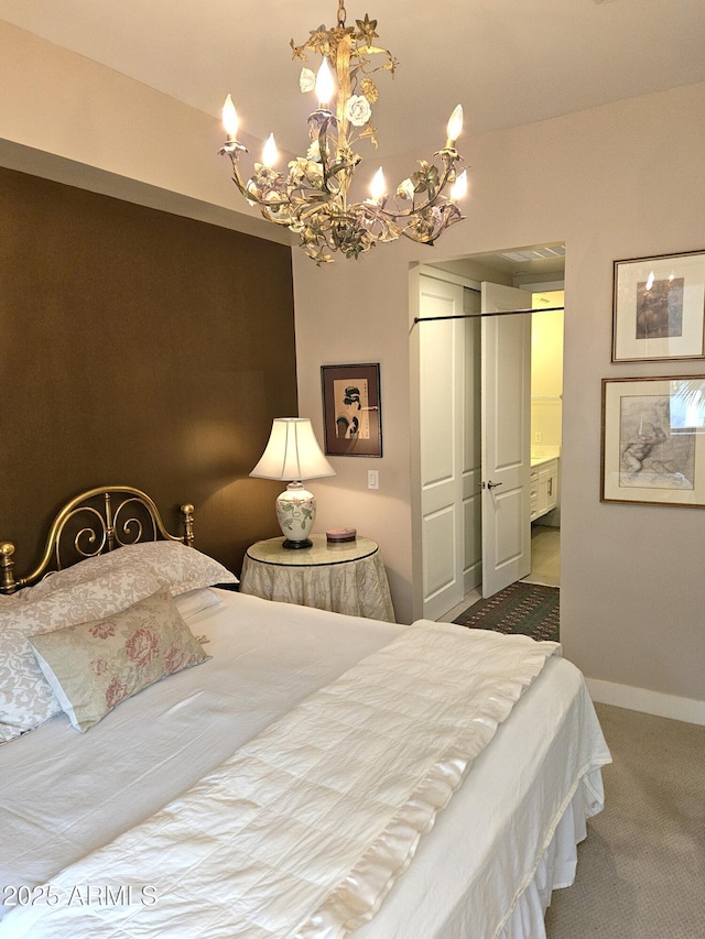 bedroom with baseboards, a closet, carpet floors, and an inviting chandelier