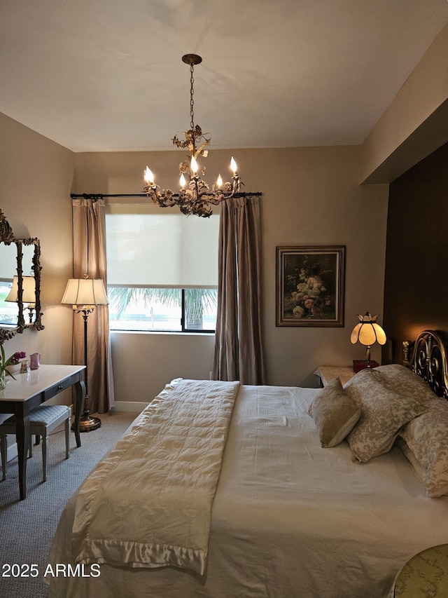 carpeted bedroom featuring a chandelier