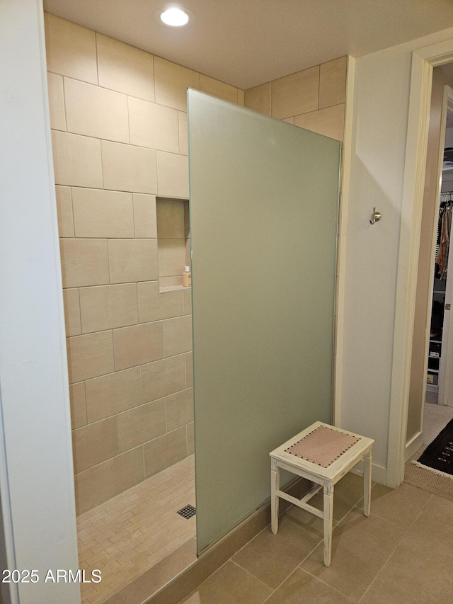 full bath with tile patterned flooring, recessed lighting, a spacious closet, and walk in shower
