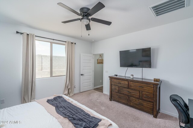 bedroom with ceiling fan and light colored carpet