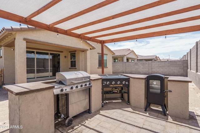 view of patio / terrace with exterior kitchen and grilling area