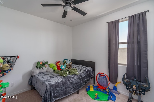 bedroom featuring ceiling fan and carpet floors