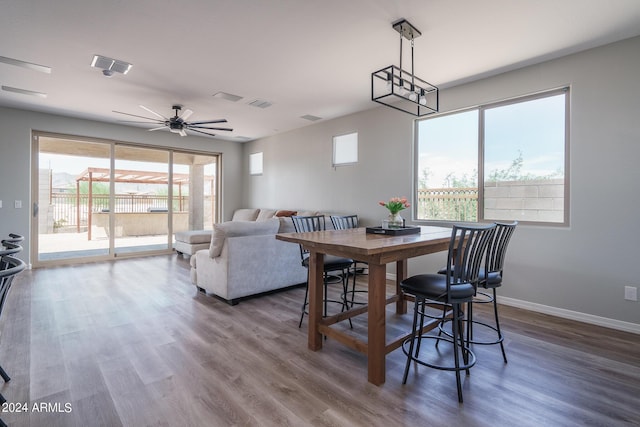 dining room with ceiling fan and wood-type flooring