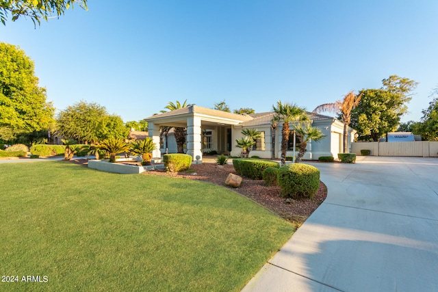 view of front facade featuring a front yard and a garage