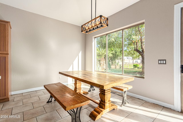 dining space with light tile patterned floors