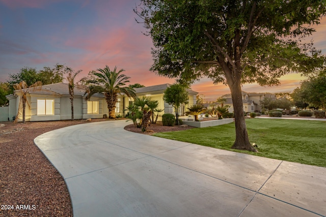 view of front of home with a lawn