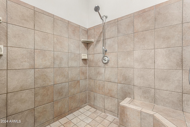 bathroom with a tile shower