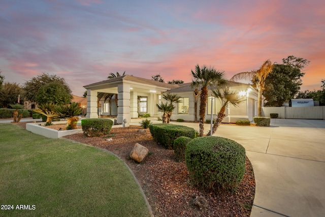 view of front of home with a yard