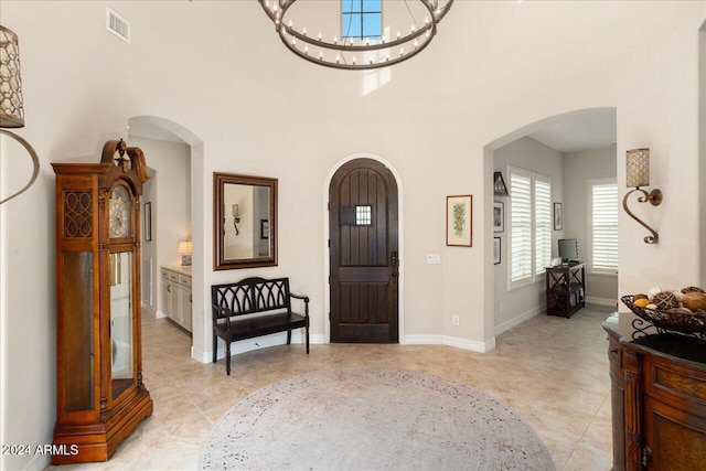 entrance foyer featuring a notable chandelier