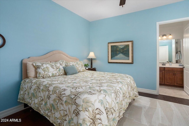 bedroom featuring ceiling fan and connected bathroom