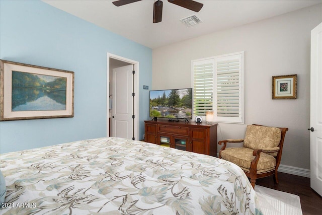 bedroom with hardwood / wood-style floors and ceiling fan