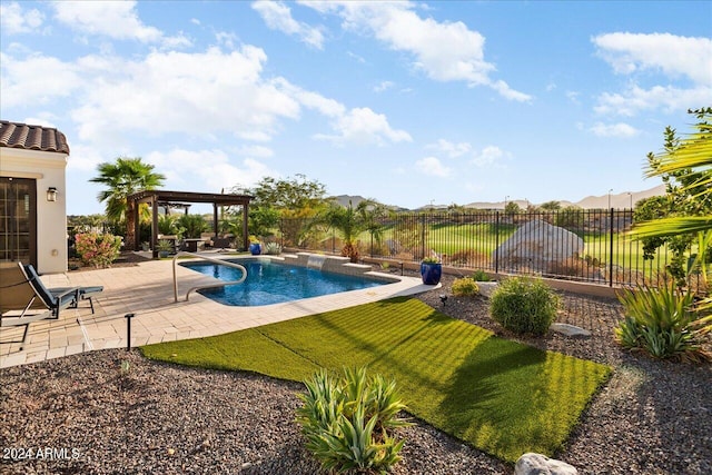 view of swimming pool with a patio and a lawn