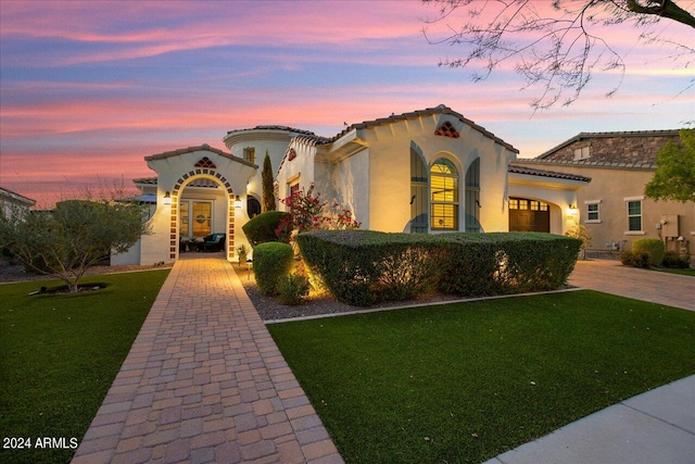 mediterranean / spanish-style house featuring a yard