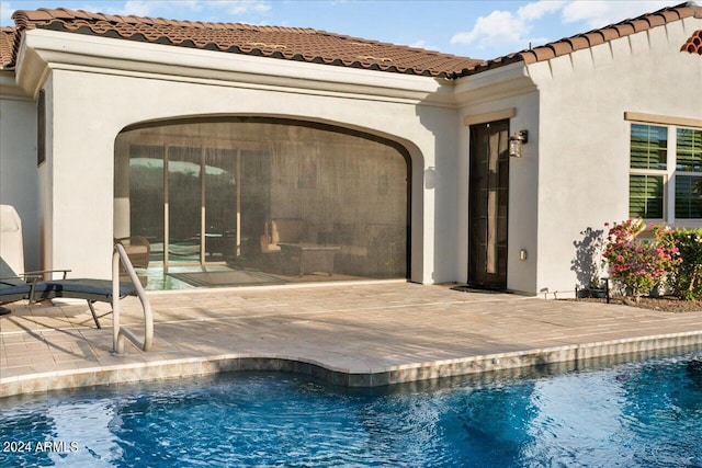 view of swimming pool featuring a patio area