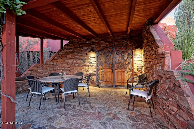 view of patio terrace at dusk