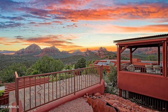 balcony at dusk with a mountain view