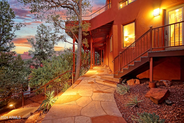 view of patio terrace at dusk