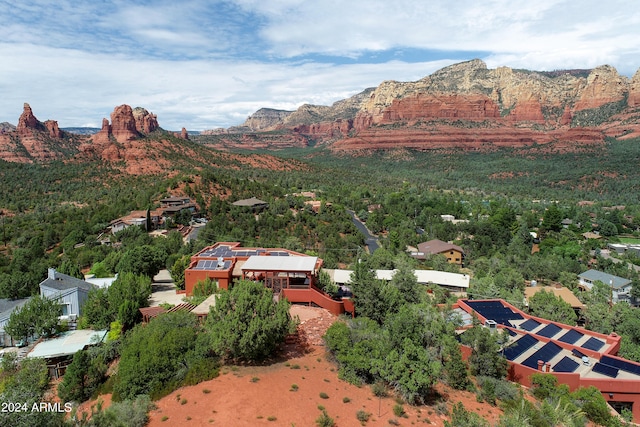 birds eye view of property with a mountain view