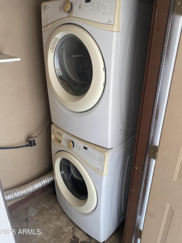 laundry area featuring stacked washing machine and dryer