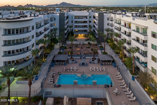 birds eye view of property with a mountain view