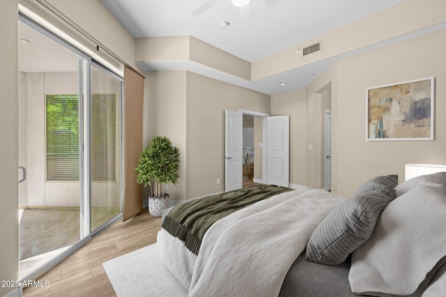 bedroom featuring visible vents and light wood-type flooring