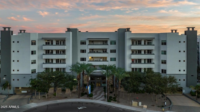 view of property at dusk