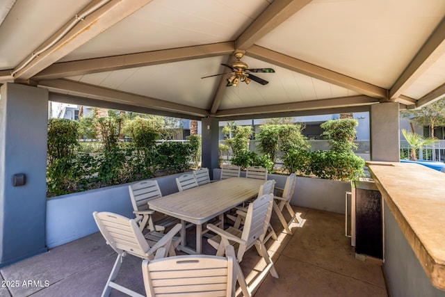 view of patio with a gazebo, a ceiling fan, and outdoor dining area