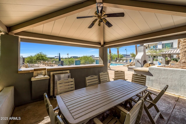 view of patio with a community pool, outdoor dining area, a gazebo, and ceiling fan