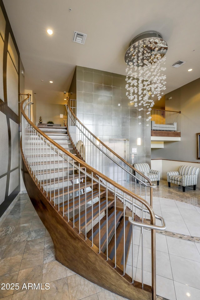 stairs featuring recessed lighting, visible vents, and tile patterned flooring