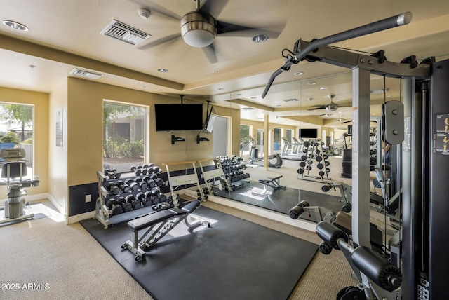 gym featuring visible vents, a ceiling fan, baseboards, and carpet floors